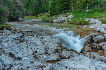 Light blue water in Soca river in summer hot evening in Slovenia