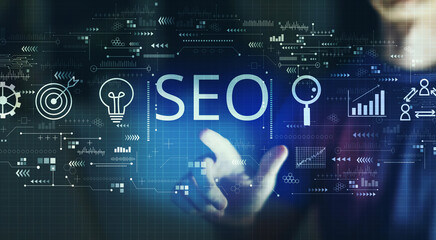 SEO concept with young man touching a digital screen at night