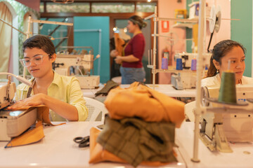 Three women working in a sewing workshop