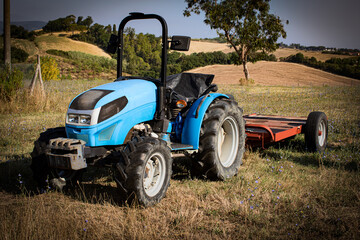 Garden mini tractor on the field, lawn tractors, outdoors
