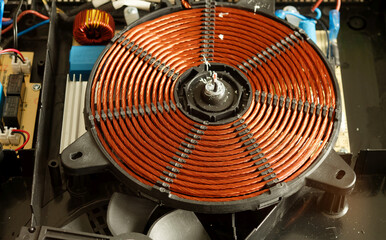 Electromagnetic spiral of an induction cooker. Parts for induction cookers. Heating element for an...