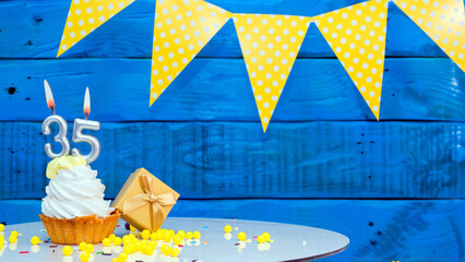 Beautiful card happy birthday with a cake with a number of candles on the background of blue...