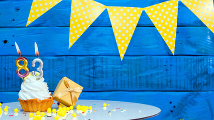 Beautiful card happy birthday with a cake with a number of candles on the background of blue...