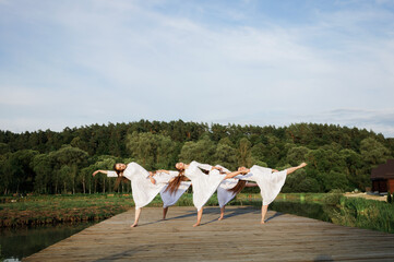 Show-ballet Ukrainian girls. Dance in traditional style against the background of nature.
