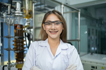 A portrait of scientist Asian woman smiling in lab or laboratory in technology medical, chemistry, healthcare, research. Experimental science. People lifestyle.