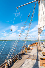 View from the deck of a small sailing ship on the river
