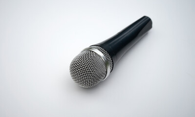 Studio microphone on a white isolate. Sing karaoke. Sound recording. Song. Voicing.