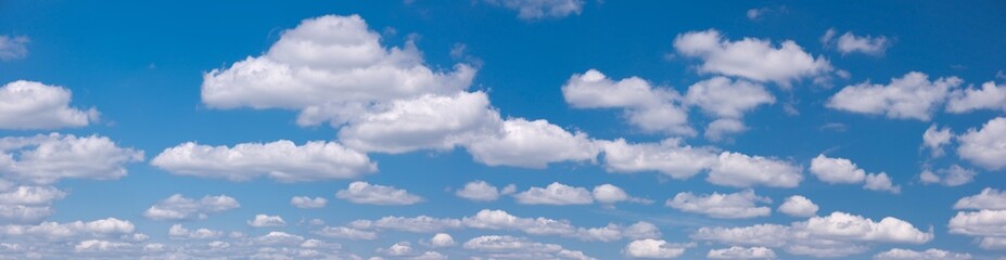 Fototapeta na wymiar blue sky panorama background with tiny clouds
