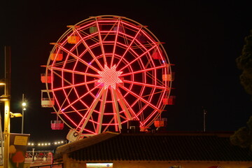 Night photo of the Ferris wheel at tibidabo theme park mountain, Barcelona
