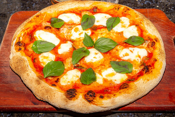 Traditional Italian Neapolitan Pizza with Mozzarella and Basil. Margherita