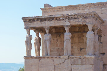 Photo of parthenon ruins in Athens, acropolis in Greece - Former ancient greek temple for Athena olympus goddess - Decorative sculptures, columns from ancient greece art, architecture and civilization