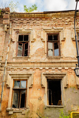 ruins. broken glass in windows of an old ruined building.