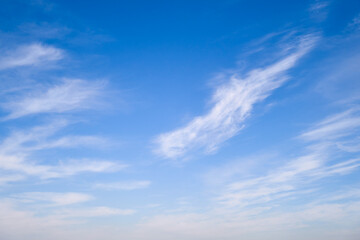 Blue sky with thin cirrus clouds, daytime landscape