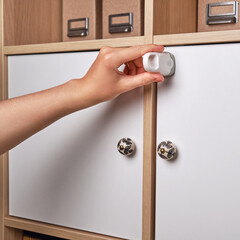 Opening the magnetic lock key to protect the cabinet doors and drawers of home furniture from...