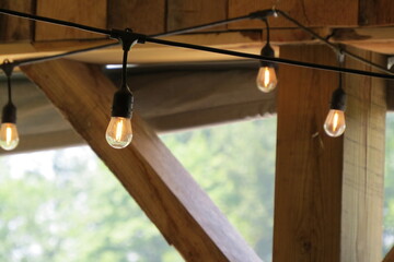 vintage string lights hanging in barn
