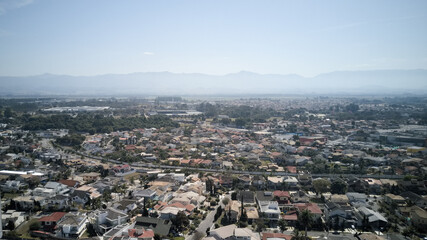 Aerial view of Taubate, with the mantiqueira mountain range in the background, on a sunny afternoon in winter