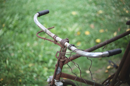 Old rusty handlebar of a broke bicycle