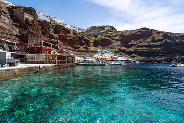 Azure waters at the picturesque Ammoudi bay in Oia, Santorini, Greece