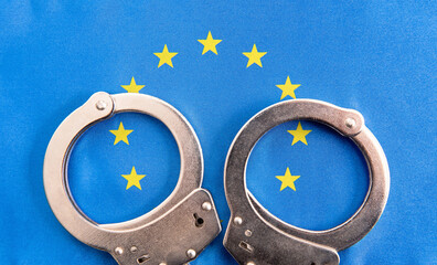 handcuffs on European flag