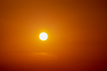 Sunset and sunrise concept, Golden yellow sky during the sun rising and going down, Orange skyline in the evening or morning, Nature background with free copy space.