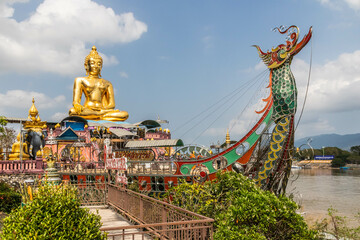 Buddah statue on boat on the Mekhong River