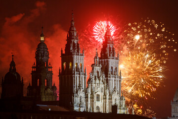 Fototapeta na wymiar Fireworks display over the Cathedral of Saint James in honor of the Day of St James Apostle Festival 2022
