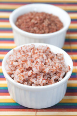 Fototapeta na wymiar cookies red rice in a bowl on table , haradighi rice 