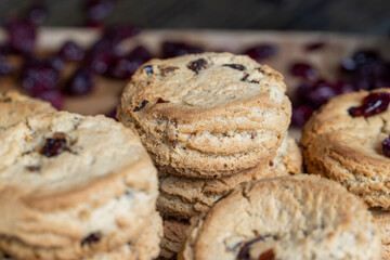 delicious dried cookies made of high-quality flour with dried red cranberries on the table