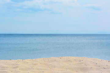 Fototapeta na wymiar Sandy beach near sea on summer day