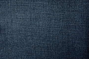 Texture of dark blue jeans as background, closeup