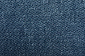 Fototapeta na wymiar Texture of blue jeans as background, closeup