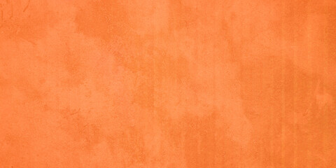 Texture of concrete surface painted in orange color as background