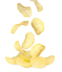 Fried crispy potato chips falling into heap on white background