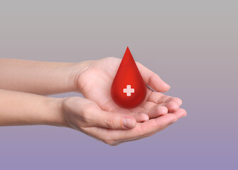 Woman holding red drop in hands on light background, closeup. Blood donation concept