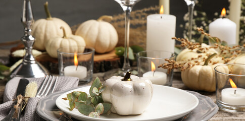 Beautiful autumn place setting and decor on wooden table. Banner design