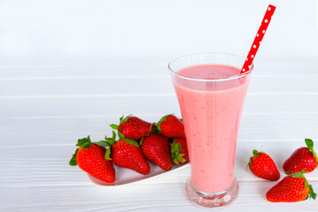Strawberry yogurt fruit juice smoothie pink colorful fruit juice milkshake blend beverage healthy high protein the taste yummy In glass drink episode morning on white wood background.