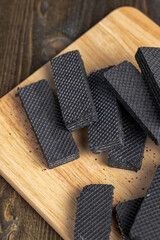 sweet dessert black waffles with creamy filling inside