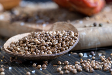 ripe whole coriander spices in a coconut bowl