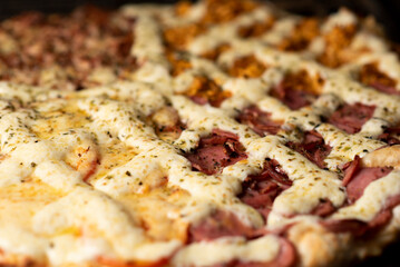 Making pizza four cheese detail