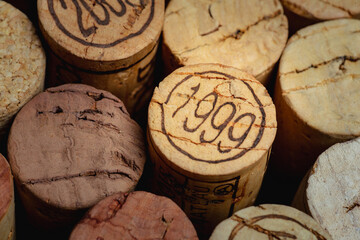 Wine corks isolated on black background closeup with 1999 close-up