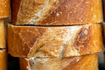 a wheat baguette cut into pieces, close up