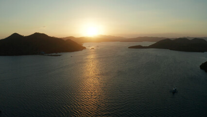 aerial view Sea bay with boats at sunset. Sunset over the sea with islands. Philippine Islands in the evening. Busuanga, Palawan, Philippines