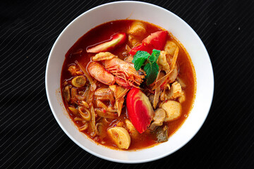 spicy tomyam shirmp soup in a bowl