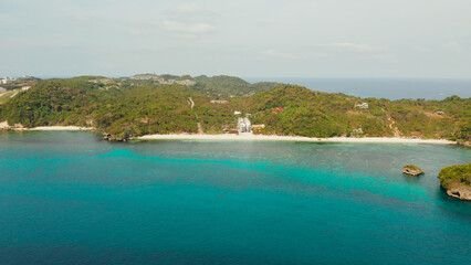 Tropical sandy beach near the blue lagoon and corall reef, aerial view Boracay, Philippines. Ilig Iligan Beach. Summer and travel vacation concept.