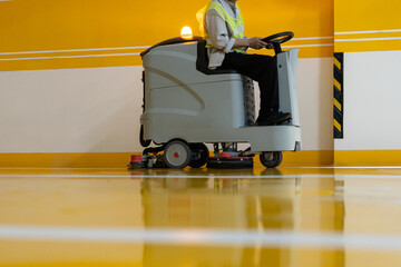 cleaning floor with machine	