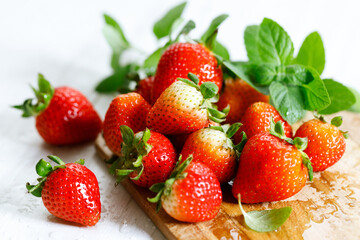 Fresh strawberries on wooden table.