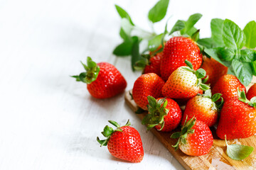 Fresh strawberries on wooden table.
