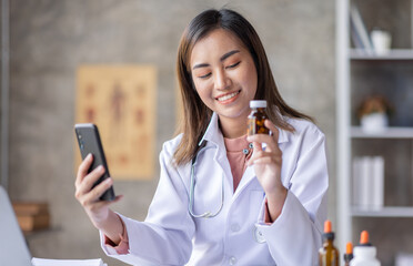 Young Asia Female  doctor talking on a cellphone in a modern office