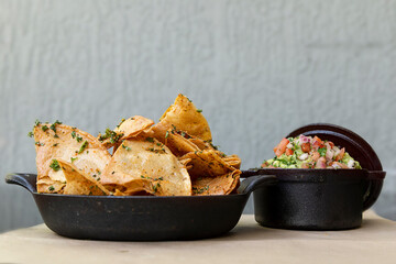 Homemade corn tortillas with a guacamole dip