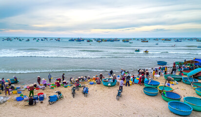 Mui Ne fish market seen from above, the morning market in a coastal fishing village to buy and sell seafood for the central provinces of Vietnam